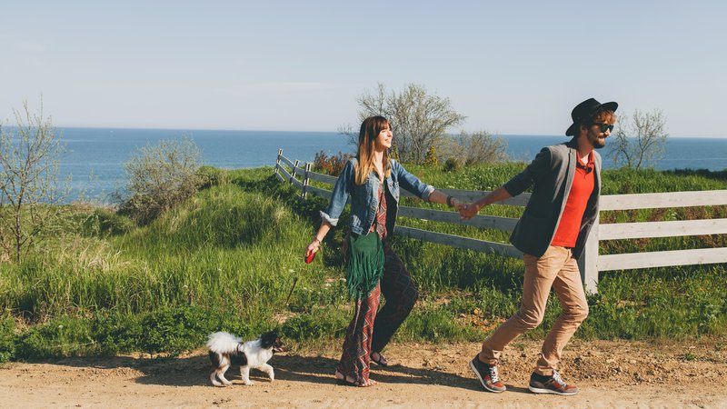 couple crossing border with dog
