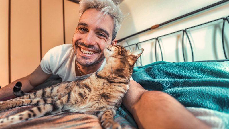 happy man with pet cat