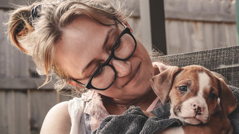 woman adopting puppy