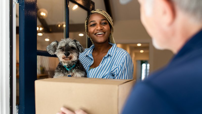 dog greeting delivery worker