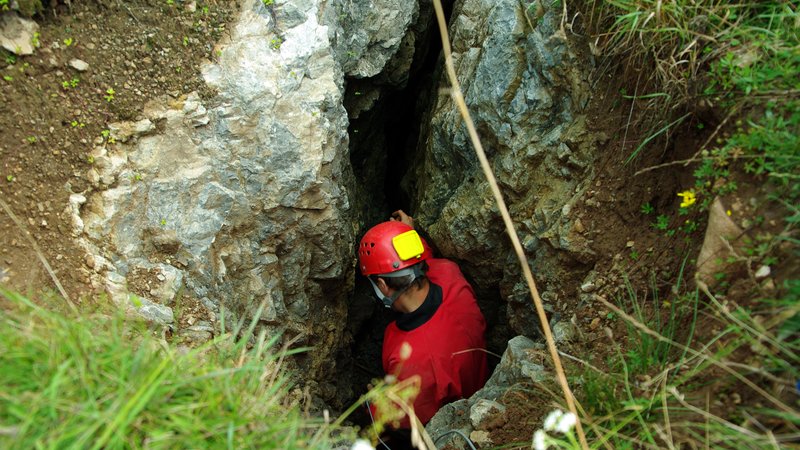 rescue worker in narrow underground passage