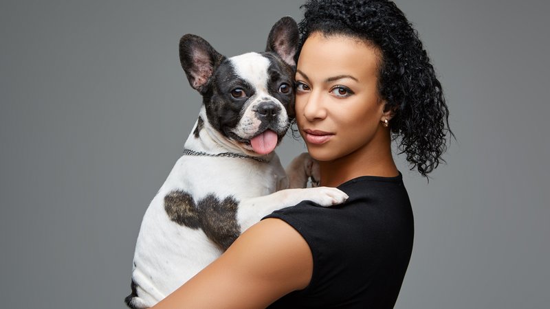 woman holding dog