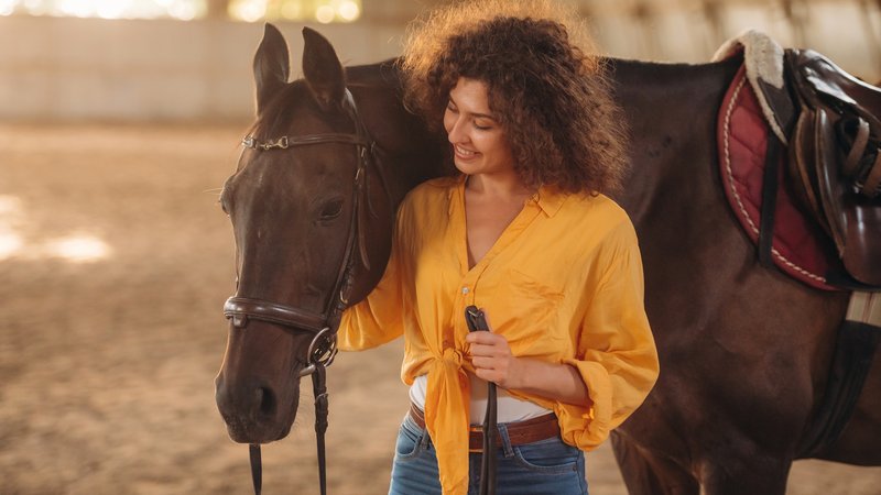 woman playing music with horse